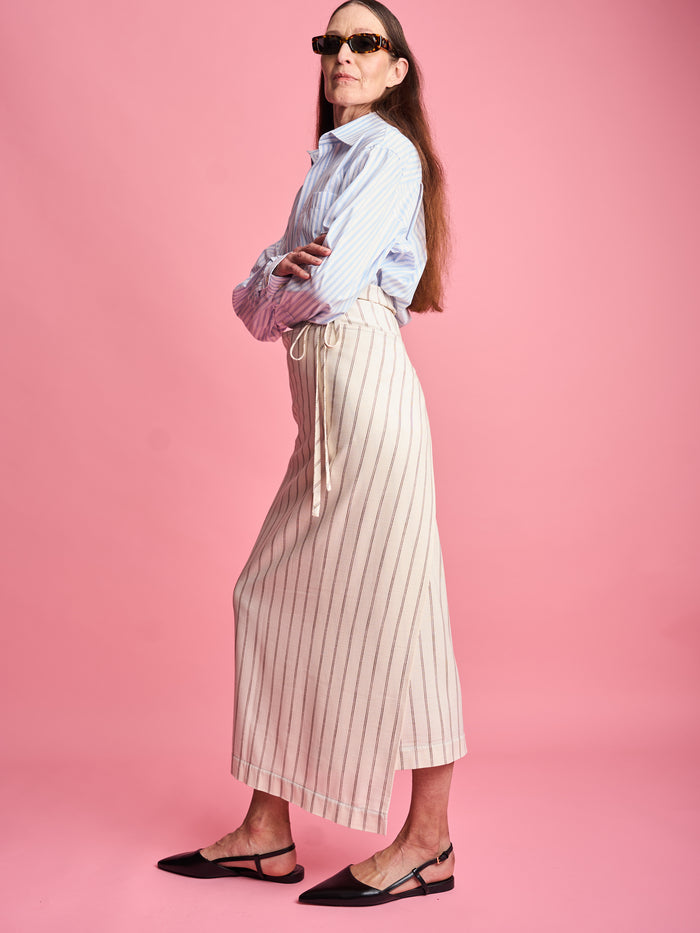 The Lucie Marquis ‘Rae Midi’, a timeless midi-length wrap skirt. An essential holiday item - this versatile piece, effortlessly transitions from day to night, making it ideal for all travel adventures. Whether lounging by the pool or exploring city life, the Rae Midi adds elegance to any ensemble.